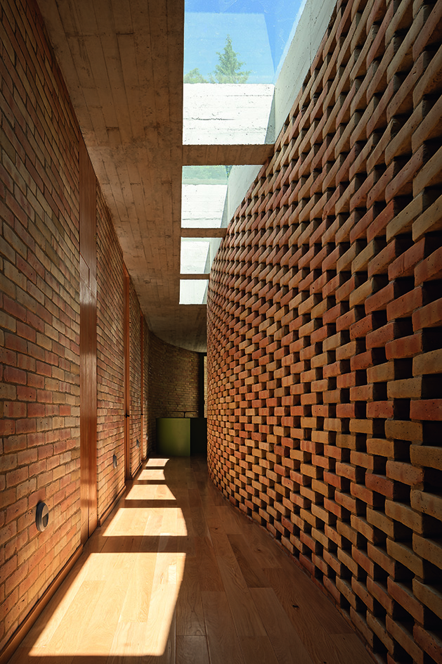 view of brick corridor at Mexican retreat casa jajalpa by lanza
