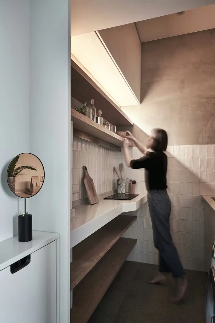 Tiny studio apartment kitchen workspace with compact appliances