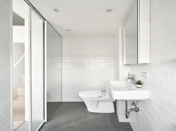 Very small studio apartment bathroom layout with compact fixtures