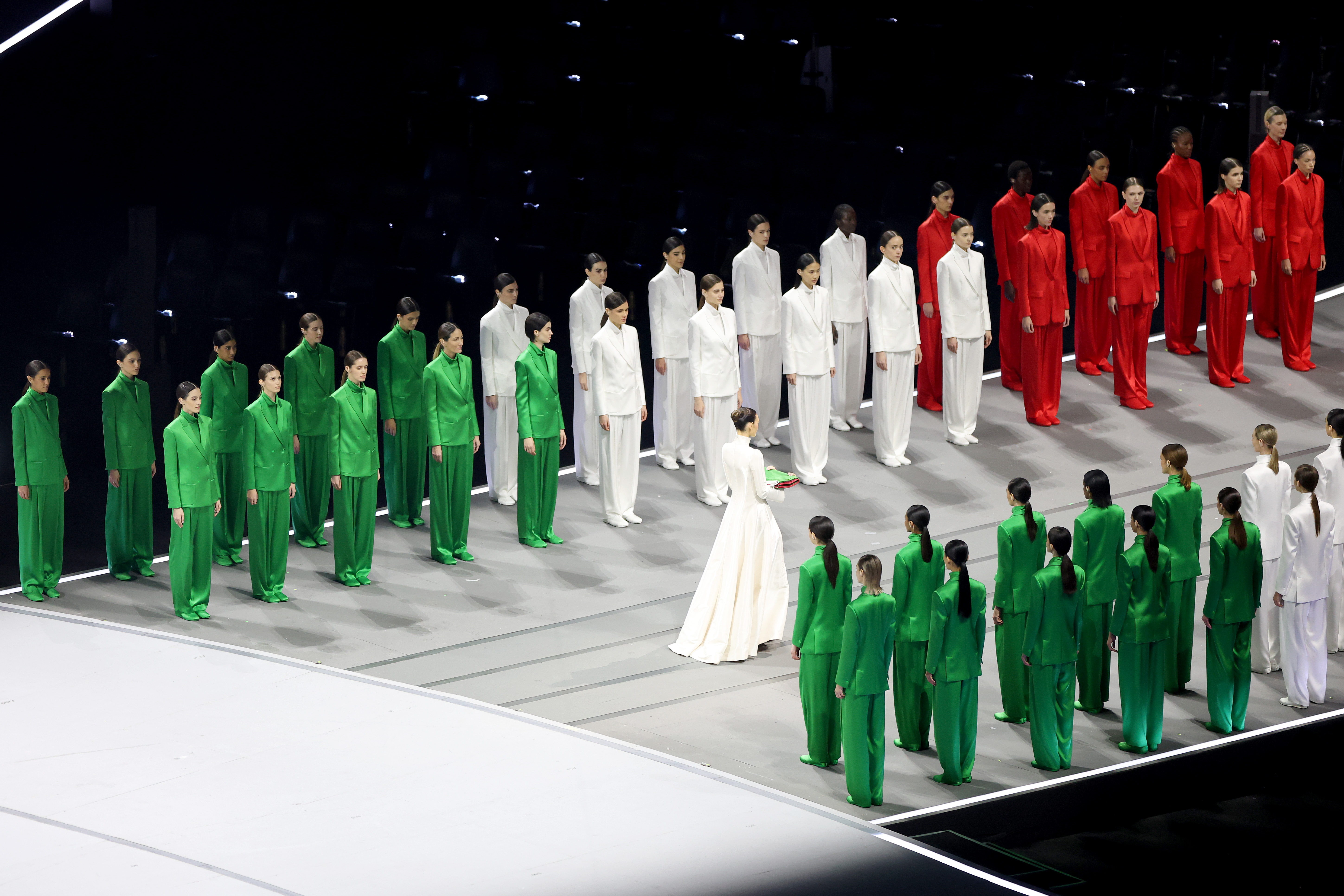 Vittoria Ceretti and models wearing Armani suits in the colours of the italian flag