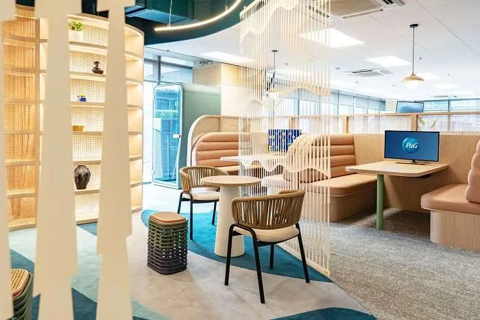 Meeting-area with curved partitions and woven detailing in a modern organic office design.