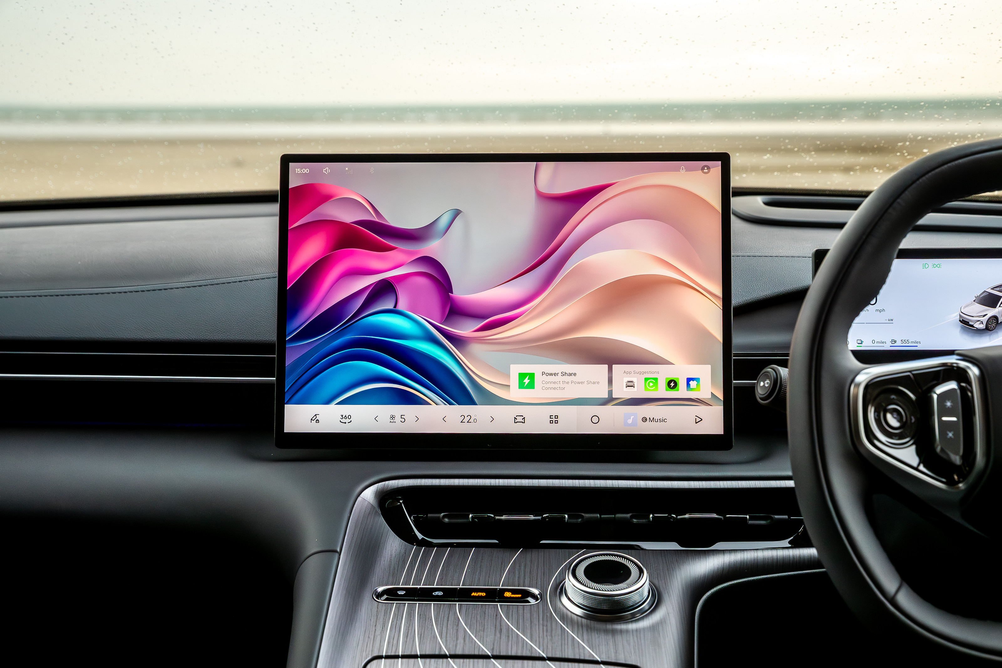 The central screen is bolstered by a separate driver information display