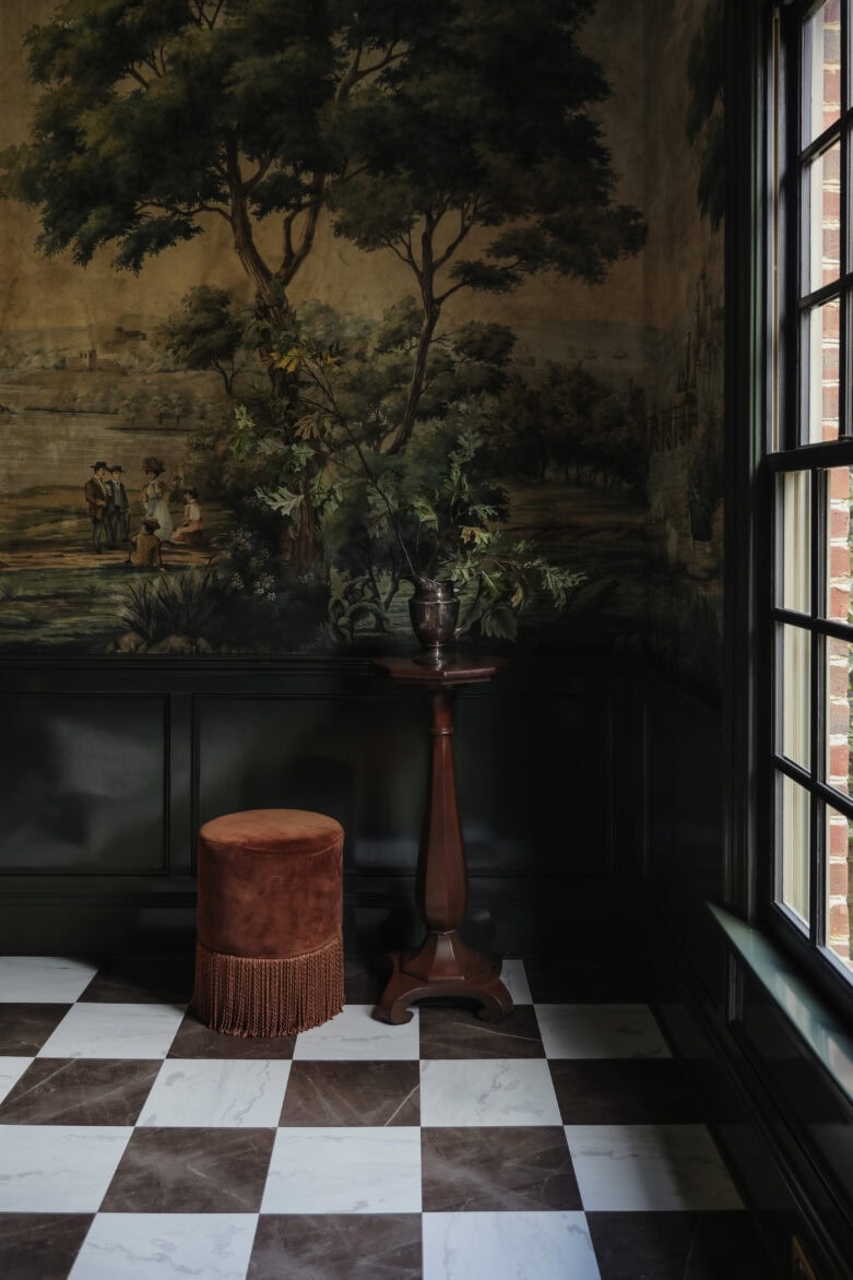 Bronze & white peel-and-stick floor tiles in a moody room