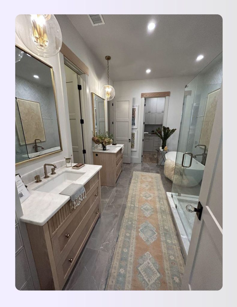 Narrow bathroom with vanity on one long wall and toilet on the opposite Narrow bathroom with vanity on one long wall and toilet on the opposite