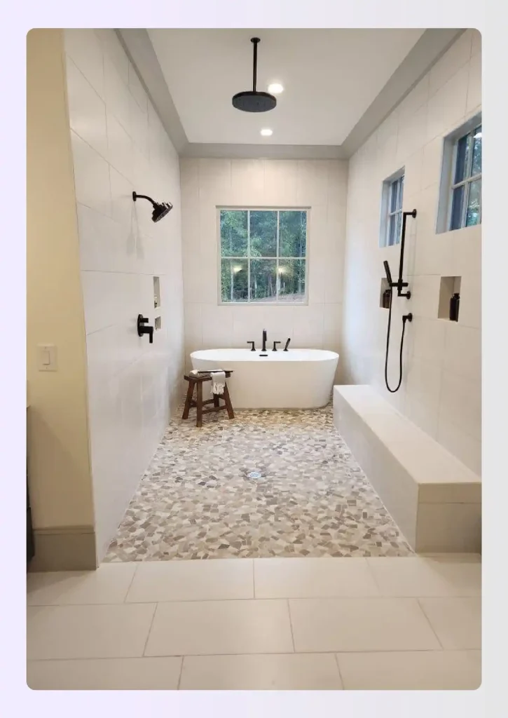 Open wet room primary bathroom with full-floor waterproofing 