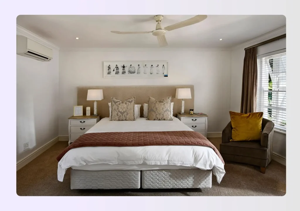 Symmetrical bedroom with centered bed, matching nightstands, and neutral wall