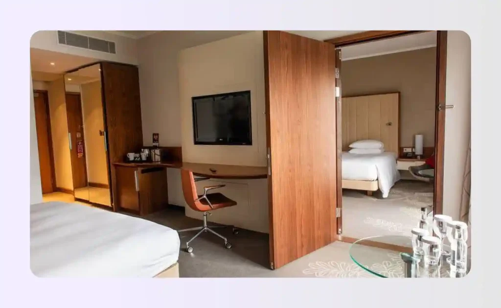 Connecting family hotel room floor plan with shared interior door between two rooms 