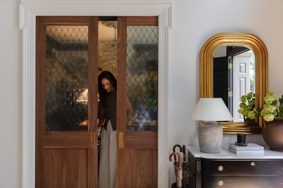 Beautiful wooden sliding doors with diamond-patterned glass panels in a modern home interior.