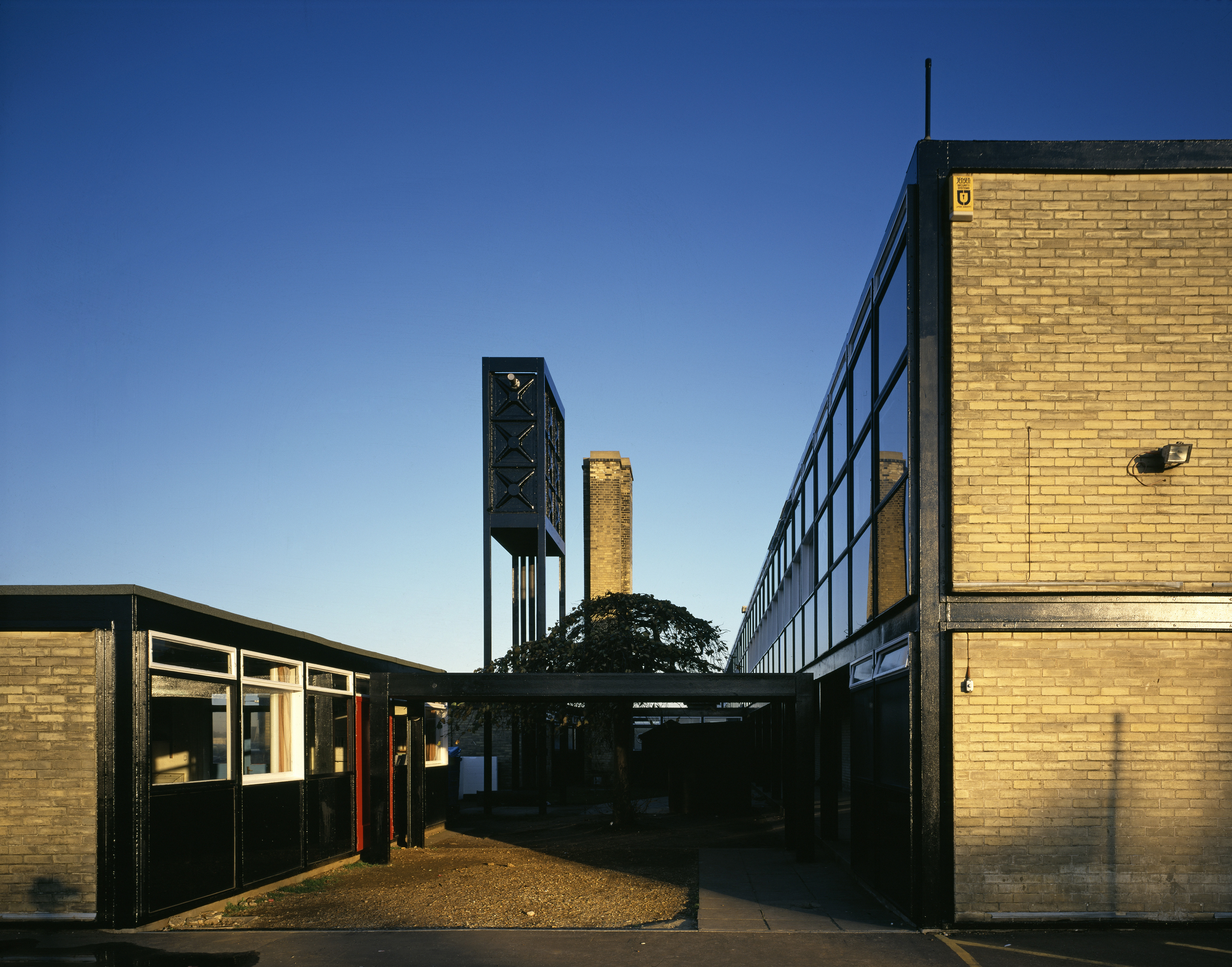 views of brutalist school on blue sky day - Hunstanton school aka Smithdon High School by alison and peter smithson